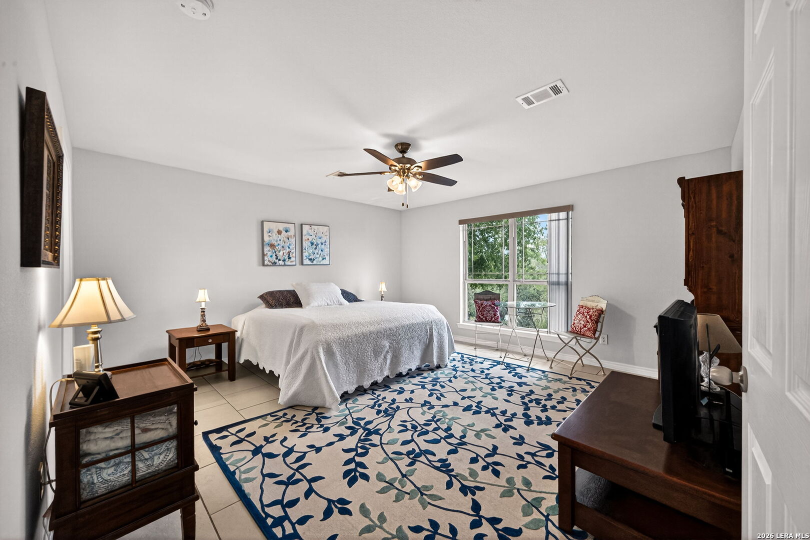 142 Harbour Vw Road Lakehills, TX 78063 - Photo 17 of 38 a bedroom with a bed and wooden floor