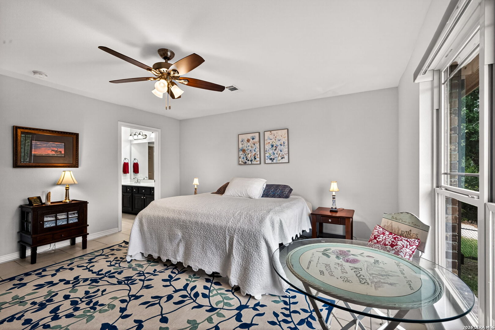 142 Harbour Vw Road Lakehills, TX 78063 - Photo 18 of 38 a bedroom with a bed and a chandelier