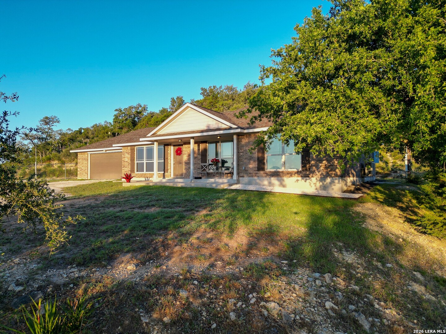142 Harbour Vw Road Lakehills, TX 78063 - Photo 4 of 38 a front view of a house with garden