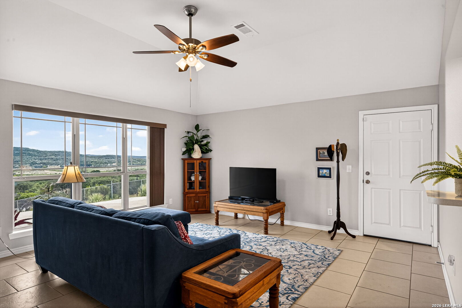142 Harbour Vw Road Lakehills, TX 78063 - Photo 8 of 38 a living room with furniture and a flat screen tv
