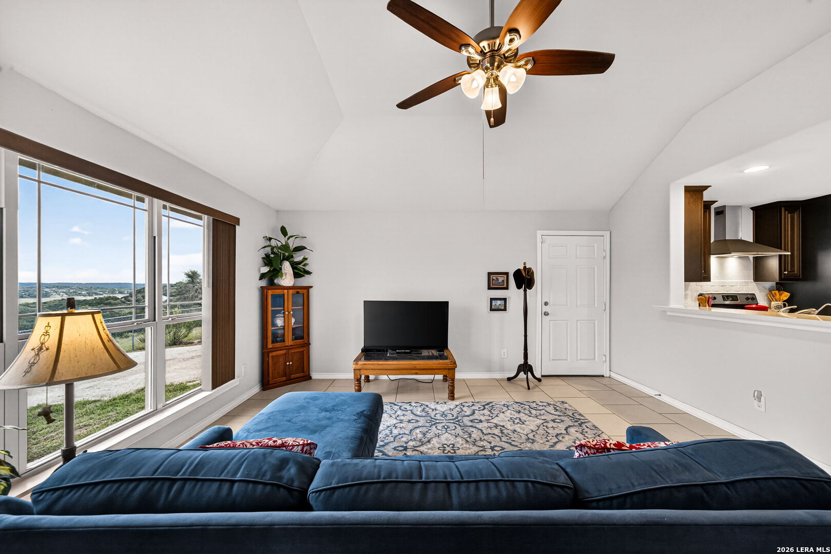 142 Harbour Vw Road Lakehills, TX 78063 - Photo 9 of 38 a bedroom with a bed a flat screen tv and a chandelier