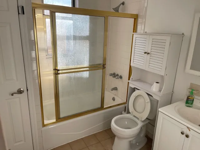 a view of a backyard with fence