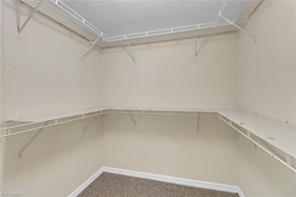 7779 Jewel Lane, Unit 103 Naples, FL 34109 - Photo 16 of 26 a view of an empty walk in closet