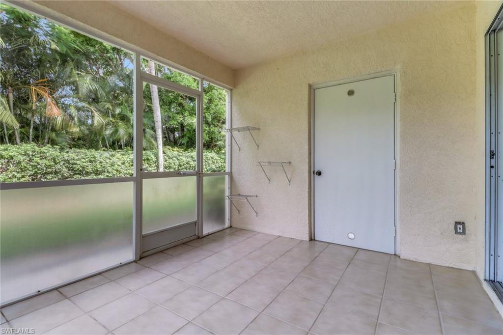 7779 Jewel Lane, Unit 103 Naples, FL 34109 - Photo 23 of 26 a view of a garden from a windows