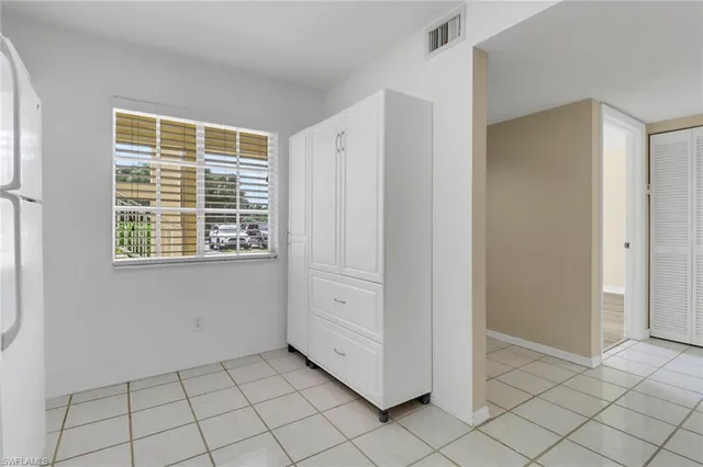 a view of an empty room with windows