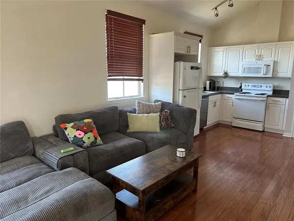 a living room with furniture and a window