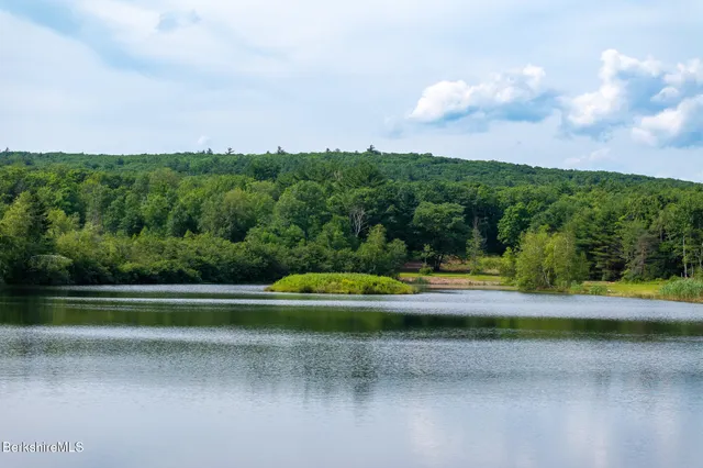a view of a fountain in front of a lake