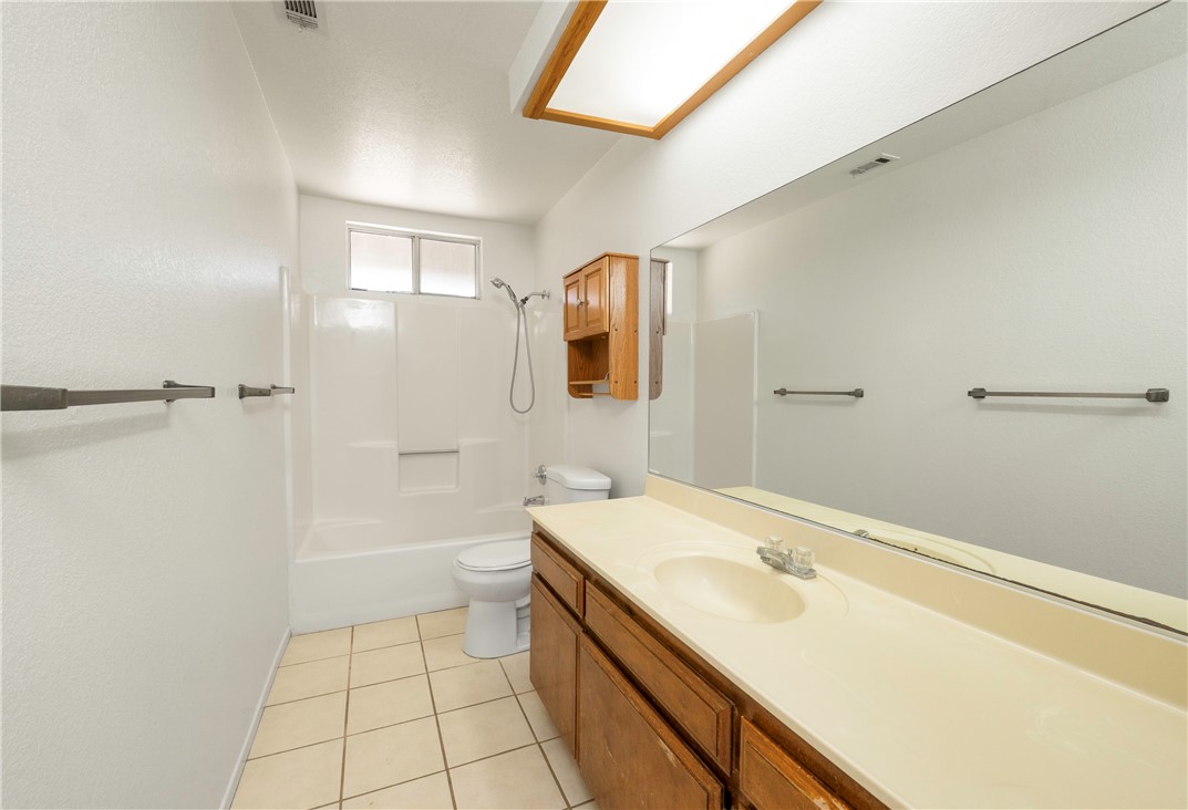 11135 Truchas Road Apple Valley, CA 92308 - Photo 18 of 35 a bathroom with a sink a toilet and shower