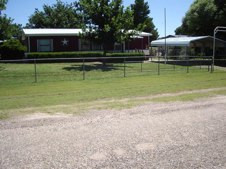1901 111th Street Lubbock, TX 79423 - Photo 2 of 10 a view of a house with a yard