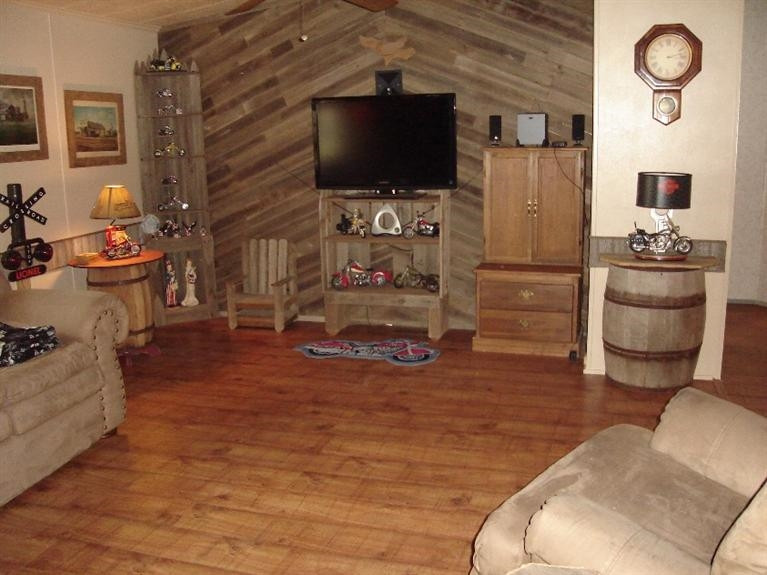 1901 111th Street Lubbock, TX 79423 - Photo 3 of 10 a living room with furniture and a flat screen tv