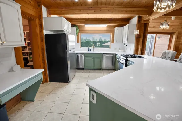 a kitchen with a stove and a sink