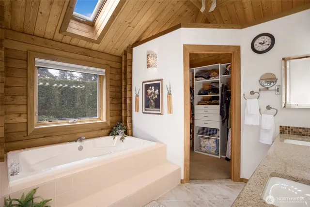 a bath tub sitting next to a window