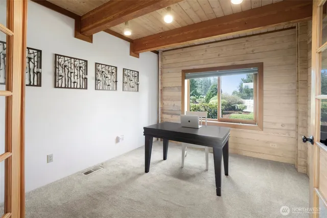 a view of a patio with a table and chairs