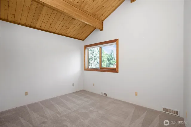 a view of a patio with a table chairs and a fire pit