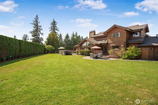 a view of a patio with table and chairs