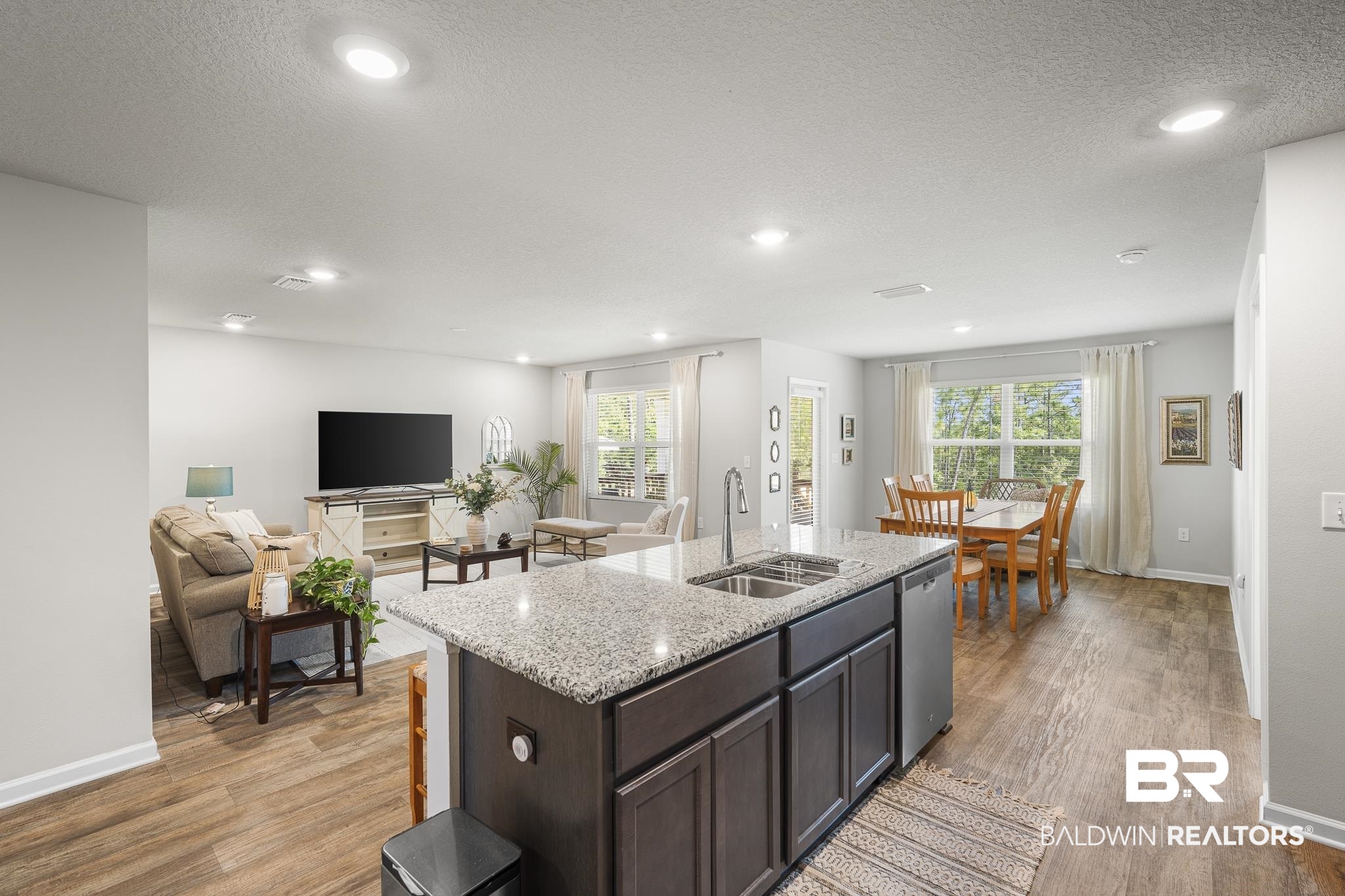 10232 Brodick Loop Spanish Fort, AL 36527 - Photo 13 of 29 Kitchen featuring a sink, dishwasher, plenty of natural light, light wood-style floors, and recessed lighting