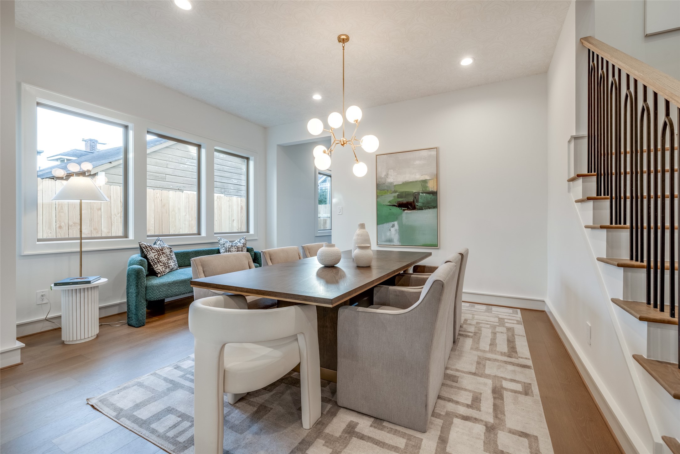 1601 Vermont Street Houston, TX 77006 - Photo 17 of 49 a view of a dining room with furniture a chandelier and wooden floor