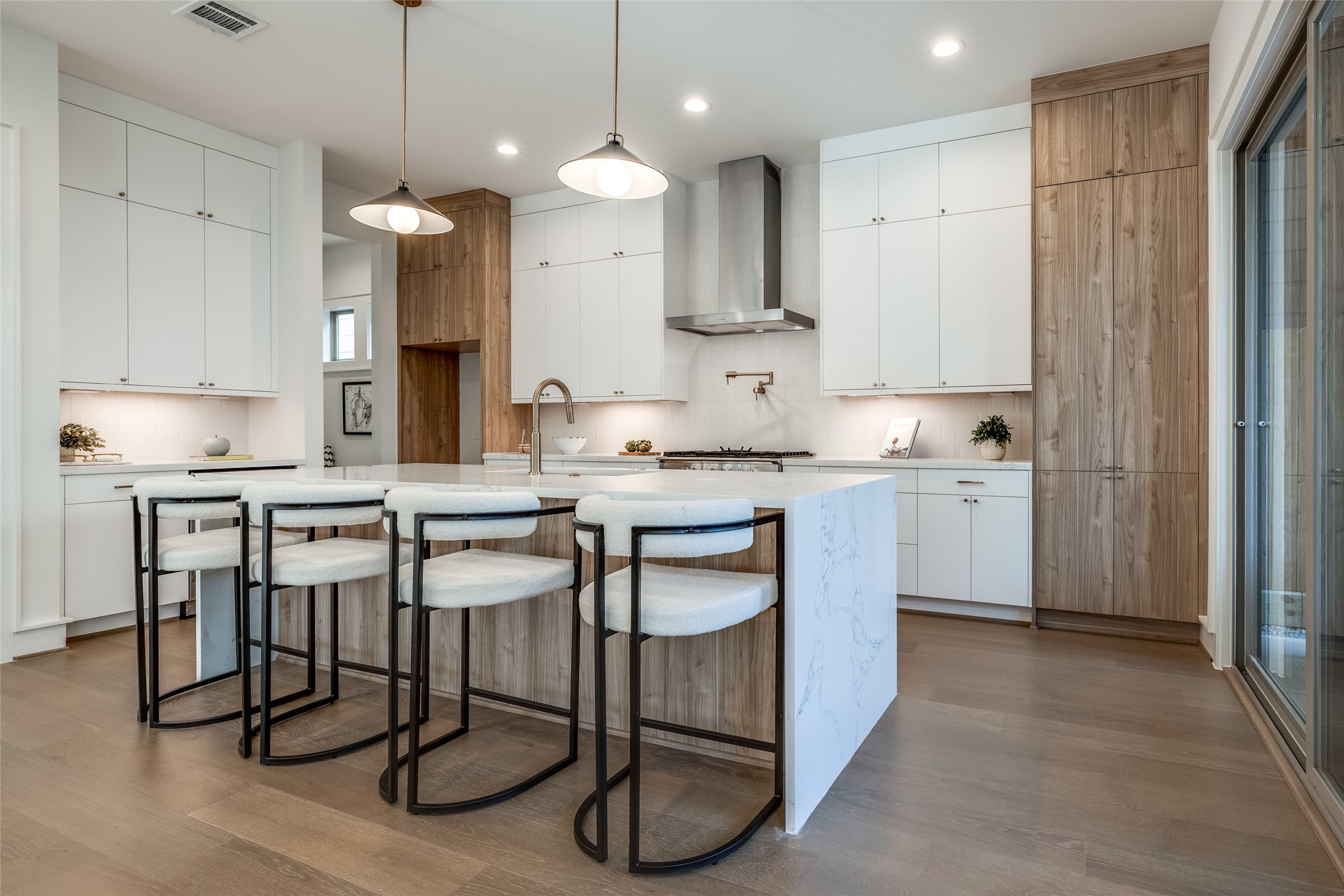 1601 Vermont Street Houston, TX 77006 - Photo 22 of 49 a kitchen with stainless steel appliances granite countertop a sink a stove a refrigerator and island with wooden floor