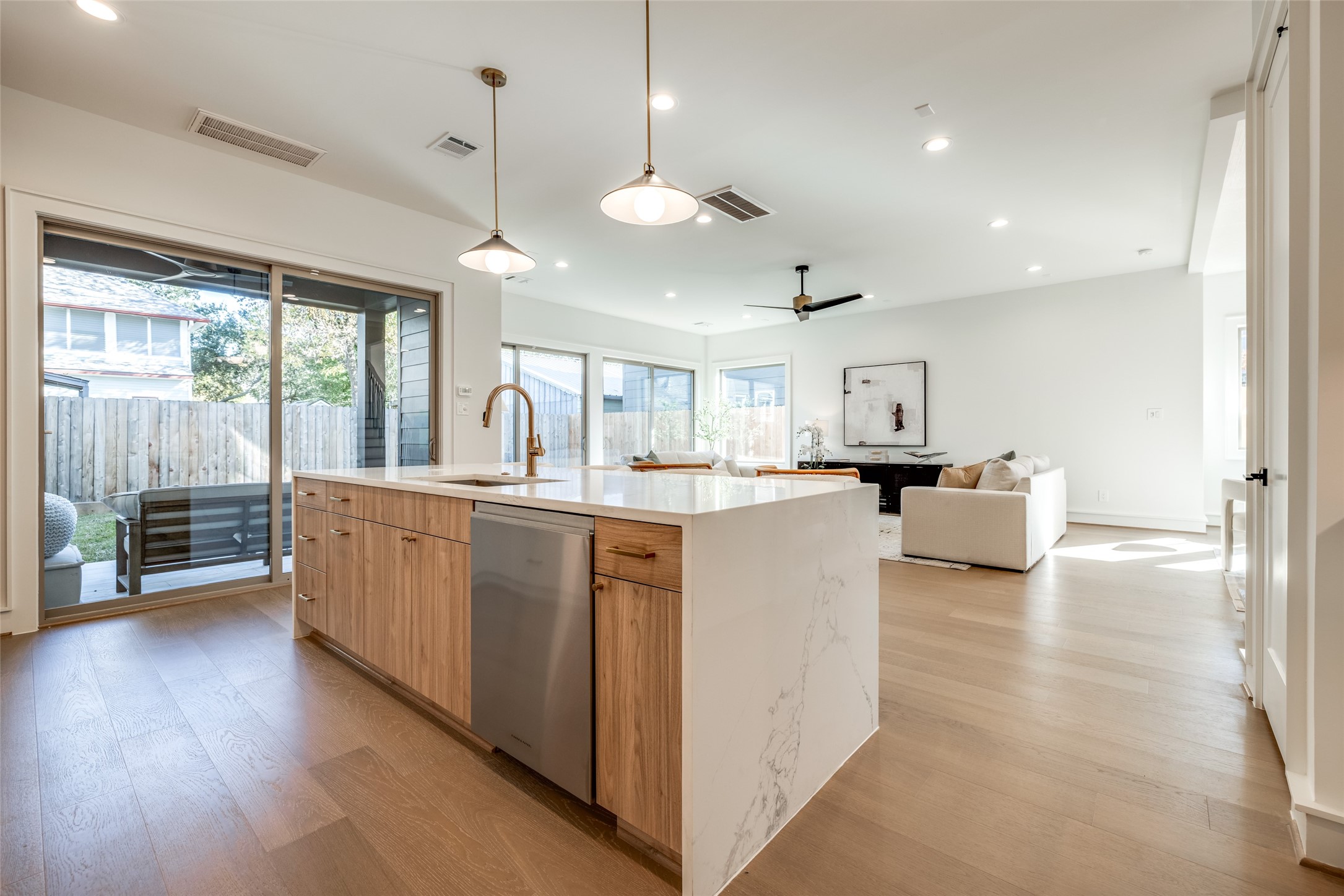 1601 Vermont Street Houston, TX 77006 - Photo 28 of 49 a open kitchen with stainless steel appliances granite countertop a refrigerator a sink dishwasher a oven and a large window with wooden floor