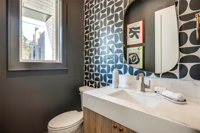 a spacious bedroom with a bed and large windows