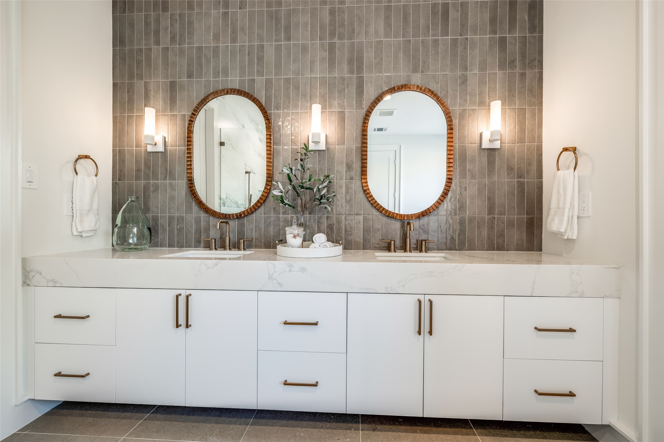 1601 Vermont Street Houston, TX 77006 - Photo 40 of 49 a bathroom with double vanity sinks and a mirror