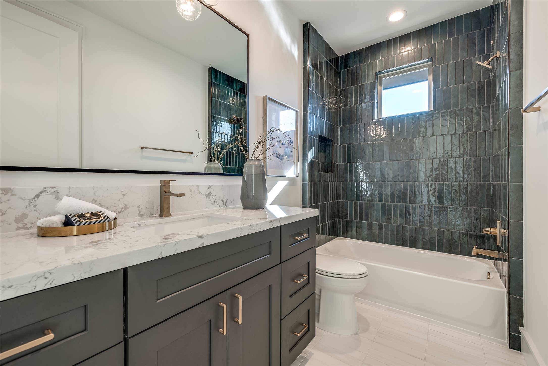 1601 Vermont Street Houston, TX 77006 - Photo 47 of 49 a bathroom with a granite countertop sink a toilet and shower
