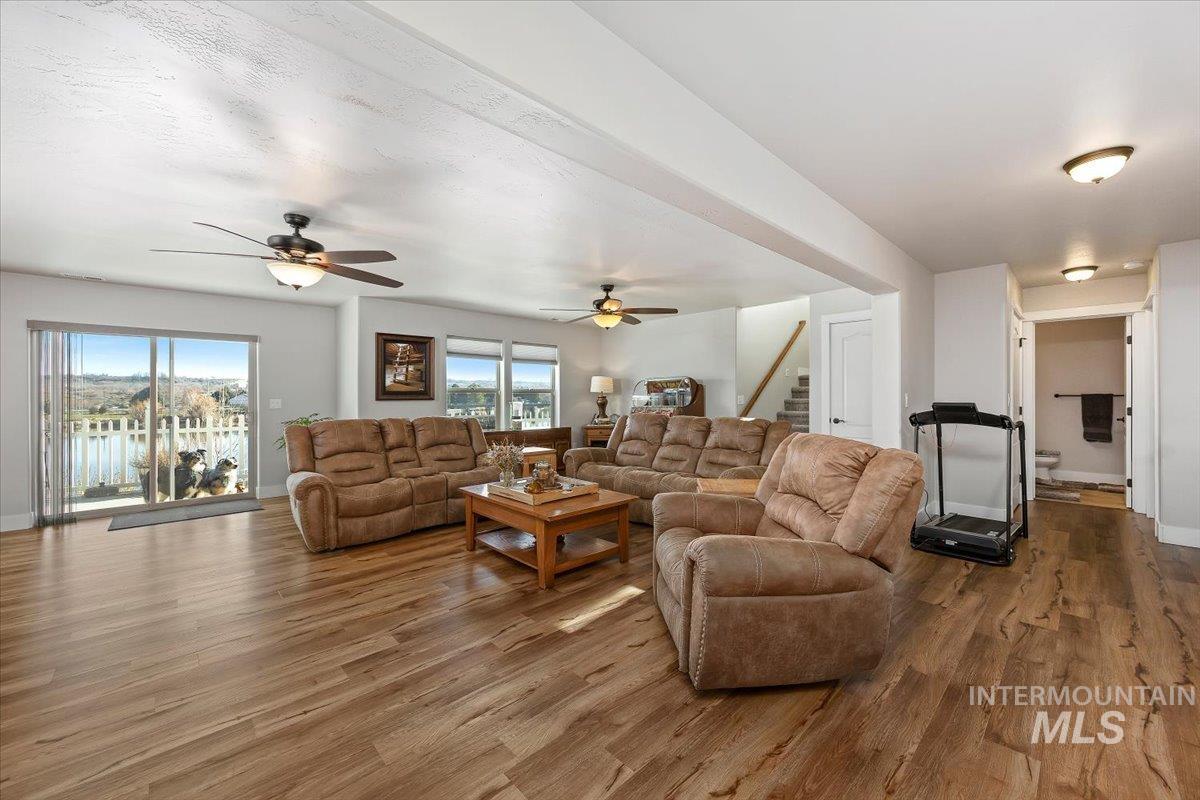 40 Bell Rapids Road Hagerman, ID 83332 - Photo 16 of 50 Living area with wood finished floors and ceiling fan