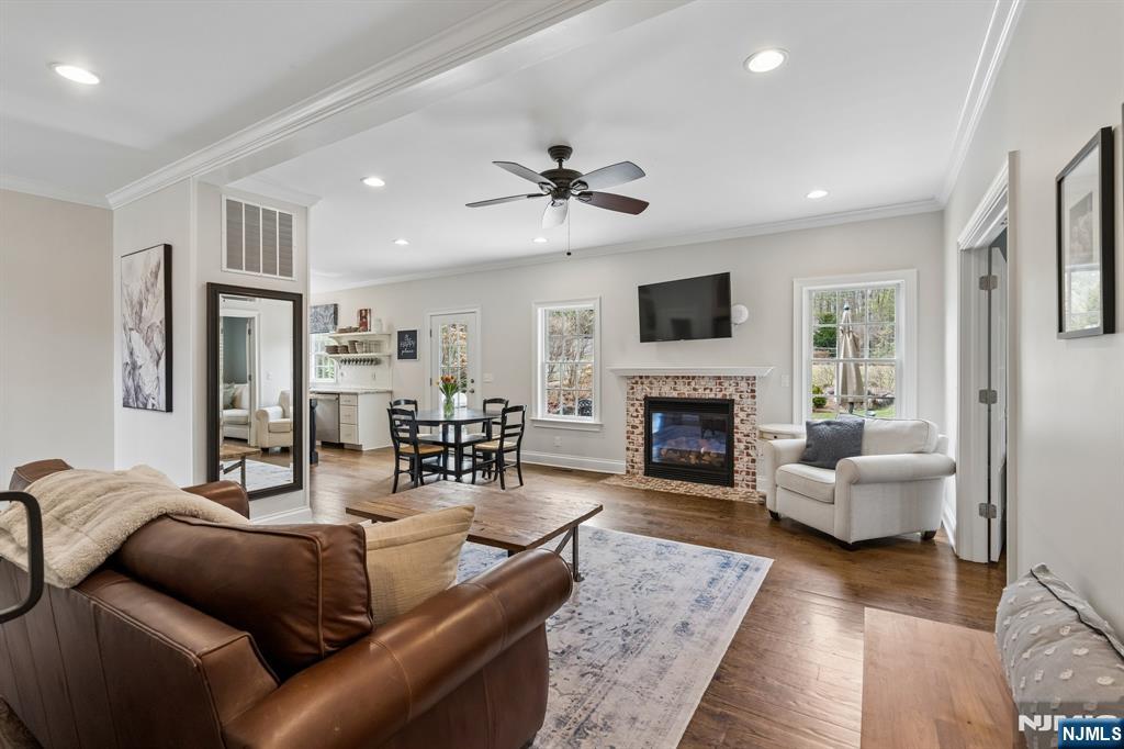 44 Millbrook Road New Vernon, NJ 07976 - Photo 12 of 45 a living room with furniture fireplace and a flat screen tv