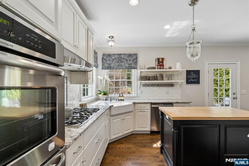 44 Millbrook Road New Vernon, NJ 07976 - Photo 14 of 45 a kitchen with a sink stainless steel appliances and cabinets