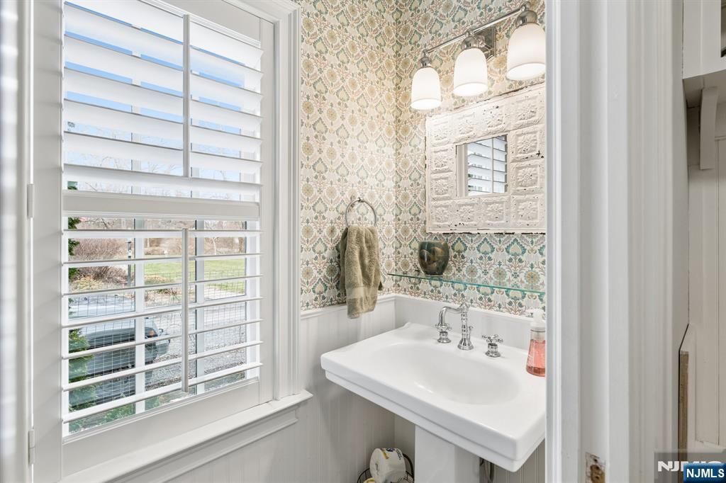 44 Millbrook Road New Vernon, NJ 07976 - Photo 19 of 45 a bathroom with a sink and a mirror