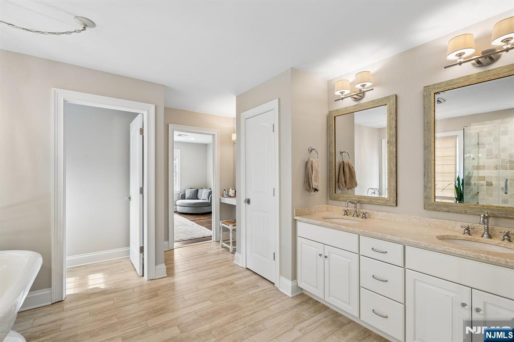 44 Millbrook Road New Vernon, NJ 07976 - Photo 24 of 45 a spacious bathroom with a granite countertop sink mirror and a