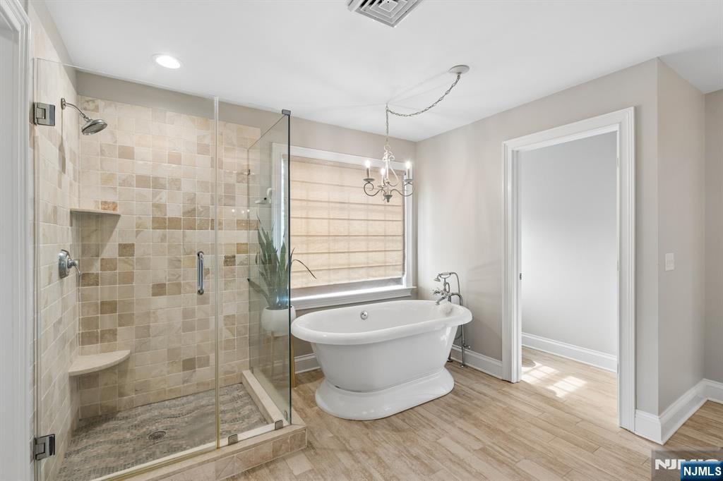 44 Millbrook Road New Vernon, NJ 07976 - Photo 25 of 45 a bathroom with a shower and a bathtub