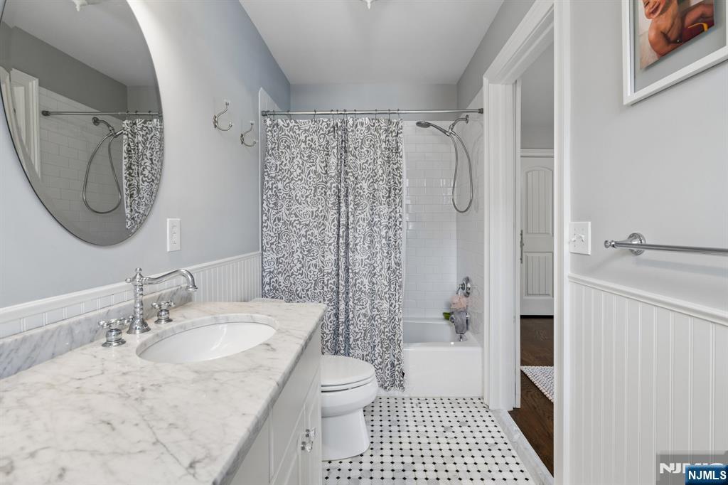 44 Millbrook Road New Vernon, NJ 07976 - Photo 31 of 45 a bathroom with a granite countertop sink a toilet and shower