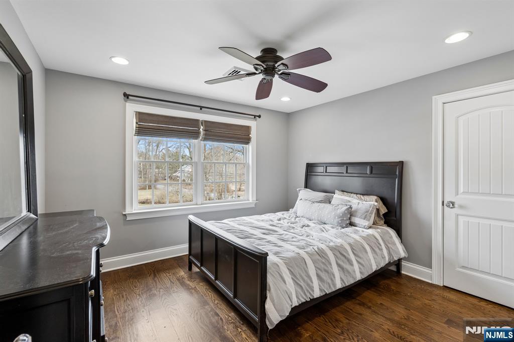 44 Millbrook Road New Vernon, NJ 07976 - Photo 32 of 45 a bedroom with a large bed and a window