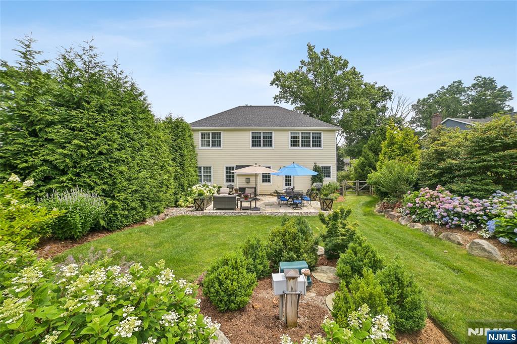 44 Millbrook Road New Vernon, NJ 07976 - Photo 43 of 45 a view of a house with a yard and sitting area