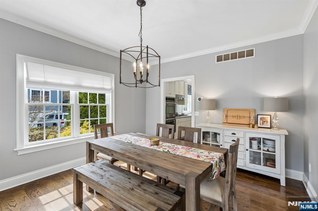 44 Millbrook Road New Vernon, NJ 07976 - Photo 7 of 45 a view of a dining room with furniture window and wooden floor