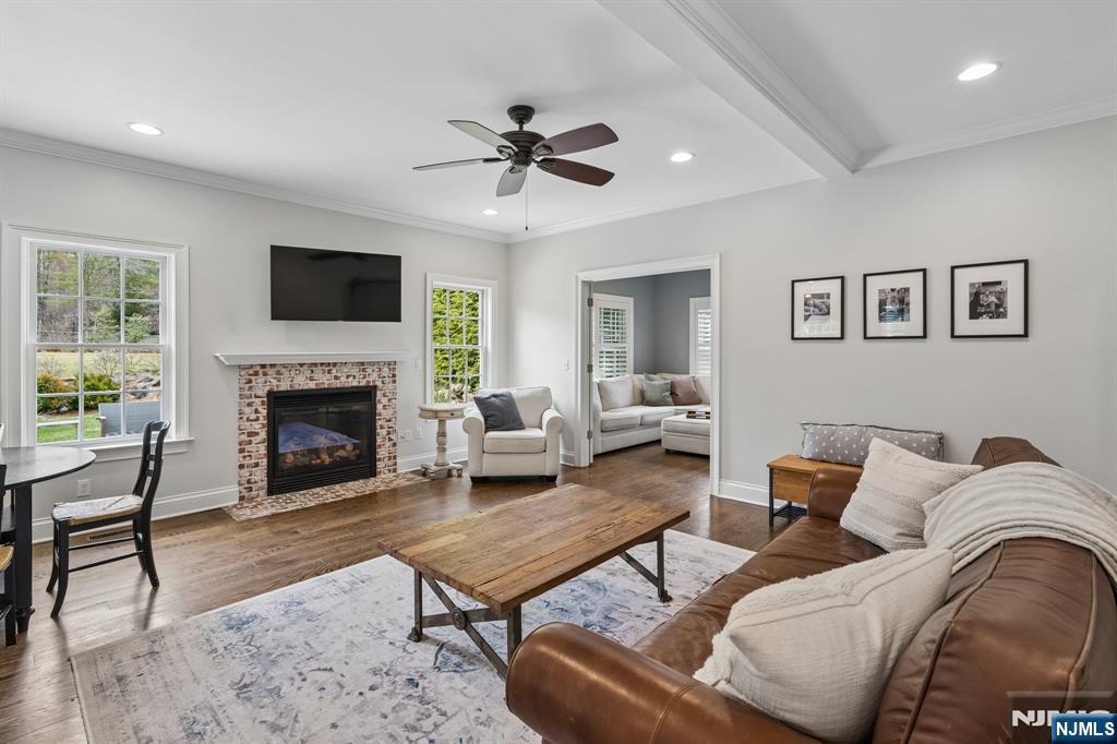 44 Millbrook Road New Vernon, NJ 07976 - Photo 9 of 45 a living room with furniture fireplace and flat screen tv