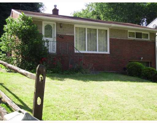 412 Spring Valley Road West Mifflin, PA 15122 - Photo 1 of 6 Exterior Front. All Brick exterior with a multi level backyard with large concrete patio