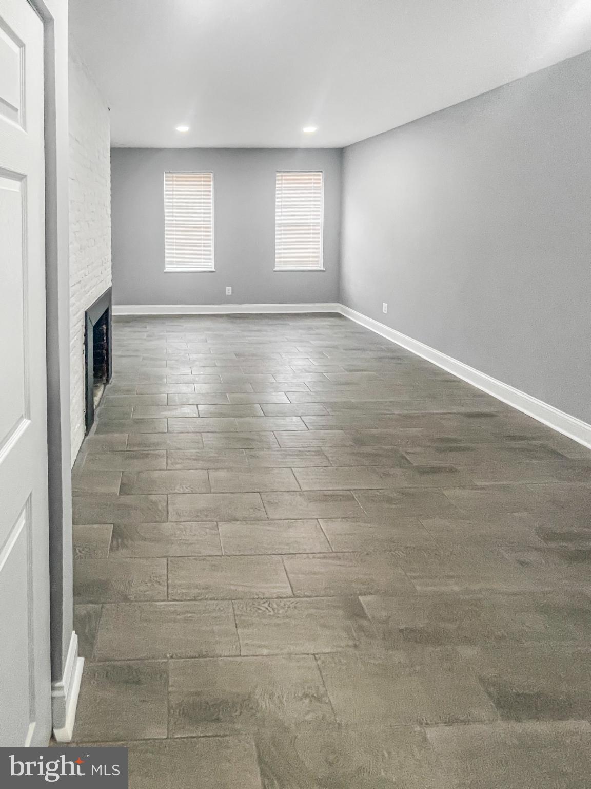 1434 Light Street Baltimore, MD 21230 - Photo 15 of 20 a view of an empty room with a window