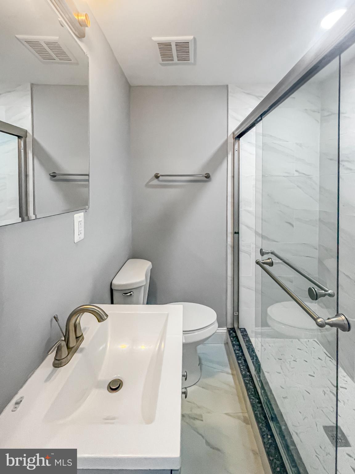 1434 Light Street Baltimore, MD 21230 - Photo 19 of 20 a bathroom with a sink and toilet