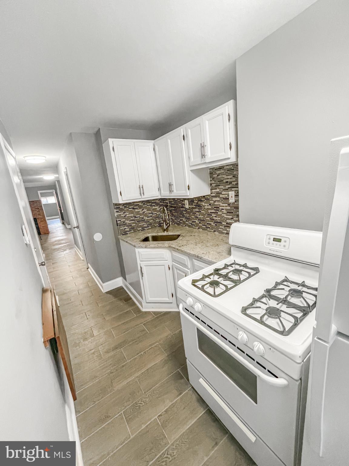 1434 Light Street Baltimore, MD 21230 - Photo 7 of 20 a white stove top oven sitting inside of a kitchen