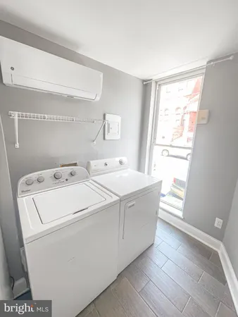 a utility room with dryer and washer