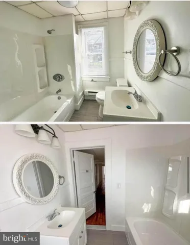 a bathroom with a sink a mirror and a toilet