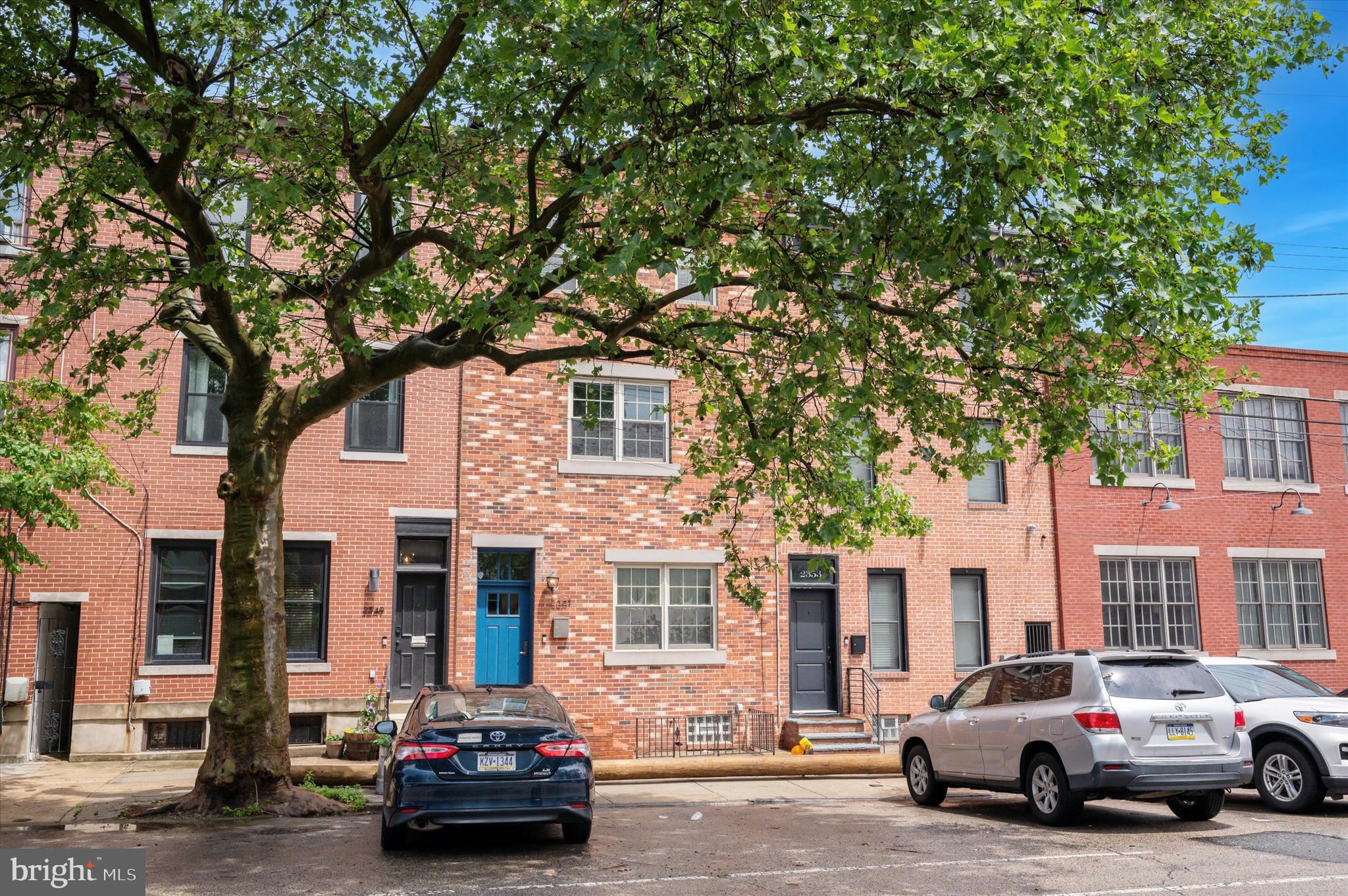 2351 East York Street Philadelphia, PA 19125 - Photo 2 of 44 a car parked in front of a houses on the roadside