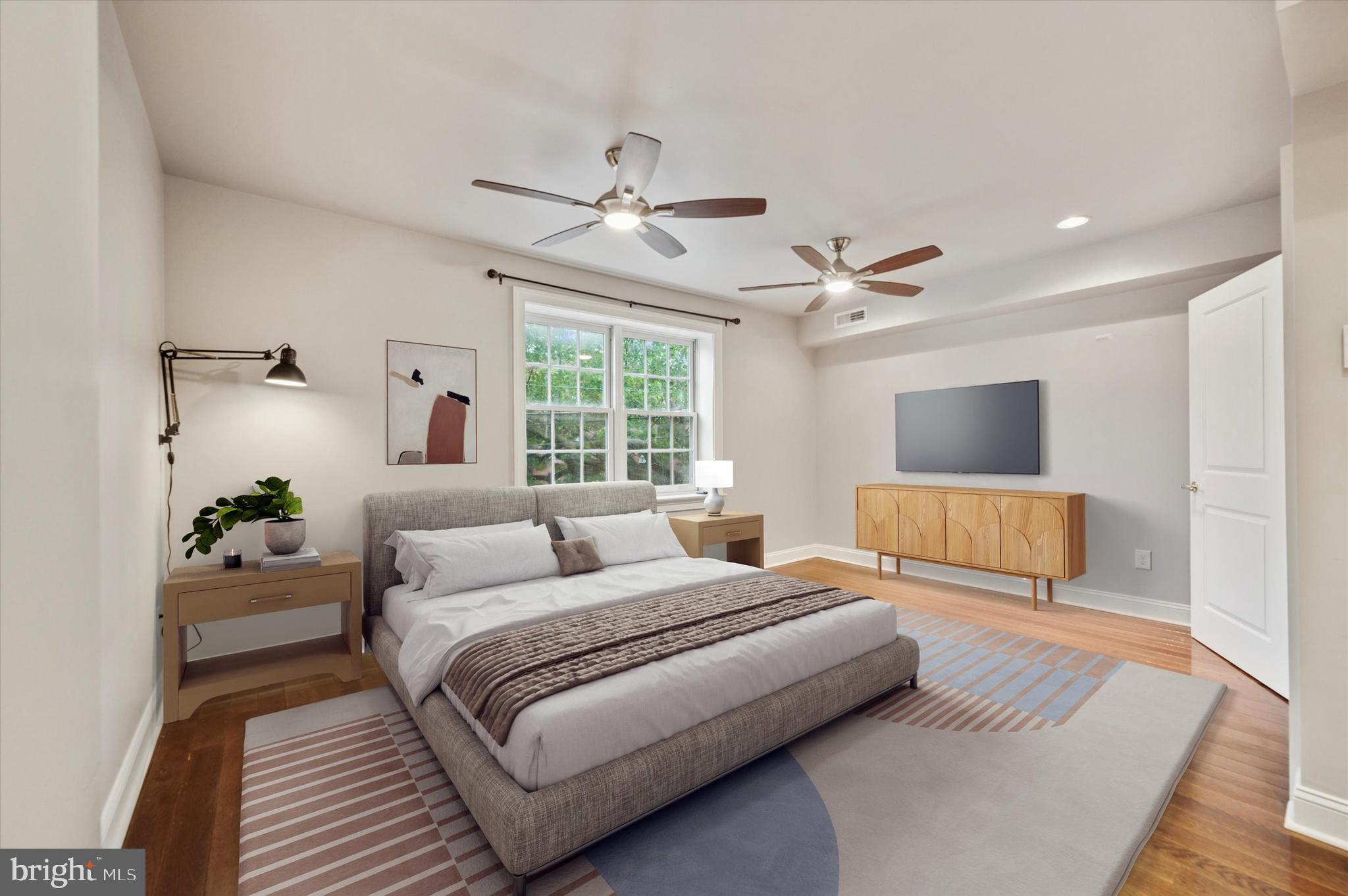 2351 East York Street Philadelphia, PA 19125 - Photo 22 of 44 a bedroom with a large bed and a window