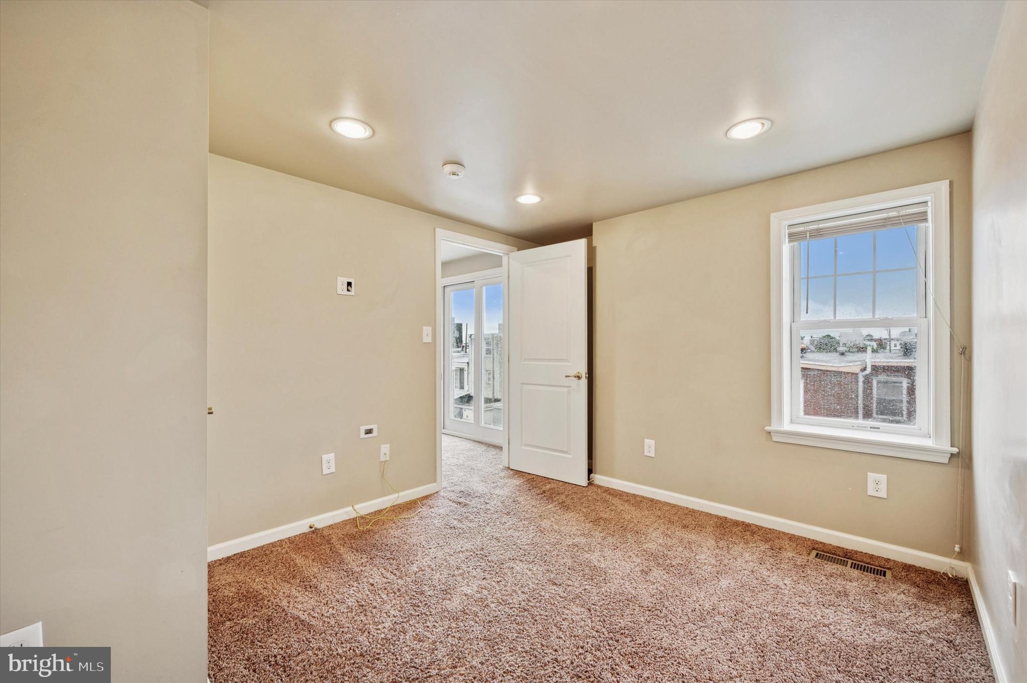 2351 East York Street Philadelphia, PA 19125 - Photo 30 of 44 an empty room with windows and closet