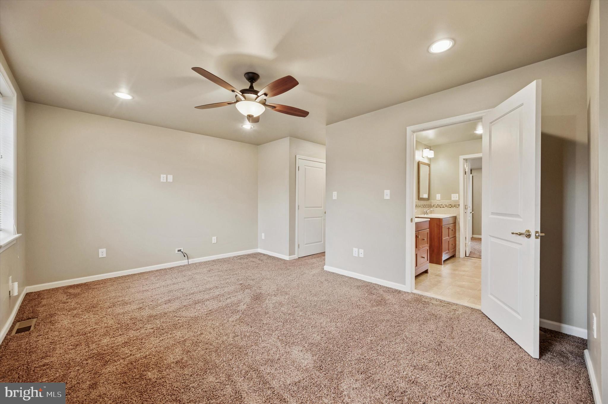 2351 East York Street Philadelphia, PA 19125 - Photo 33 of 44 an empty room with fan and entrance