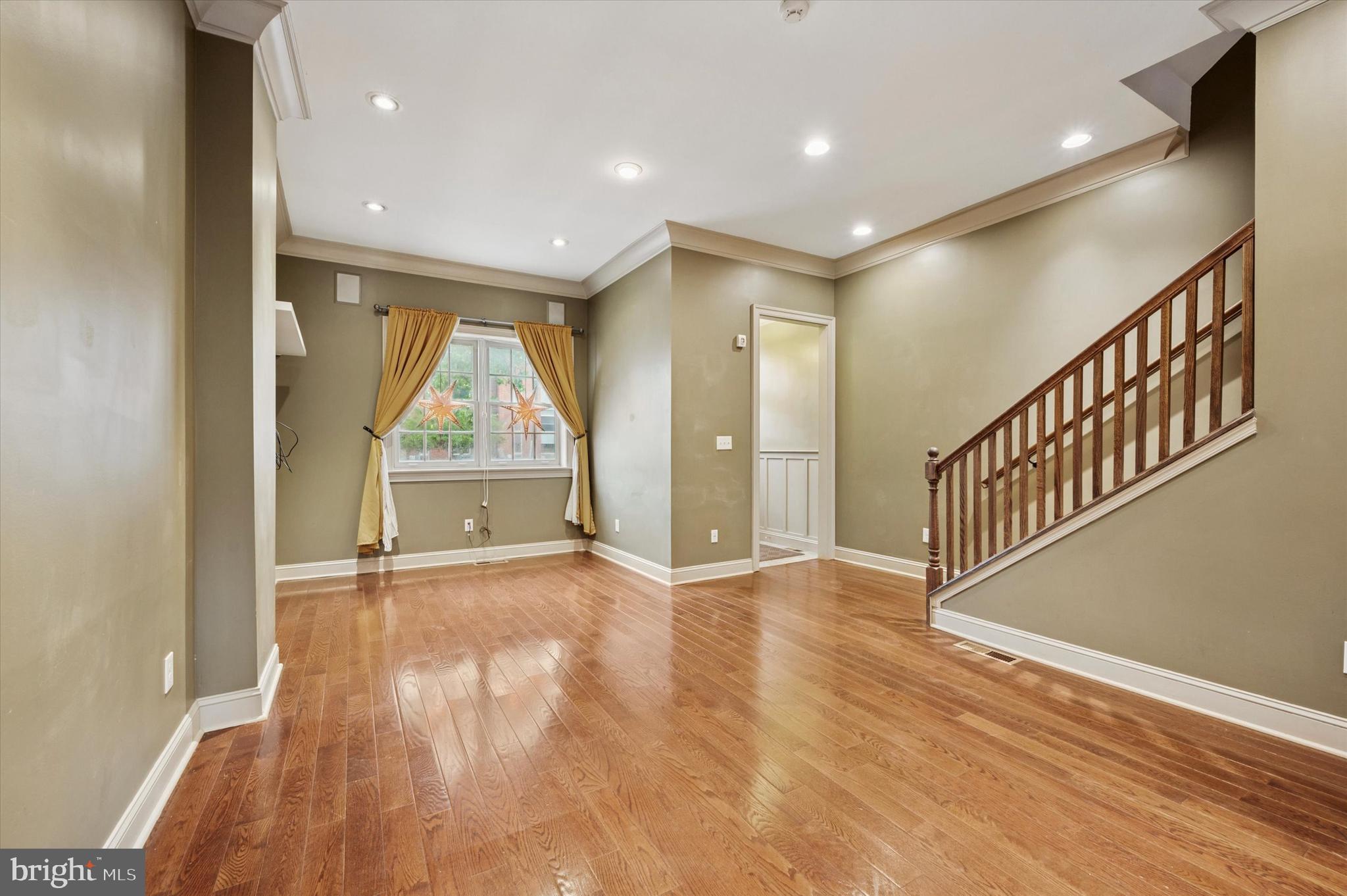 2351 East York Street Philadelphia, PA 19125 - Photo 6 of 44 an empty room with wooden floor and windows