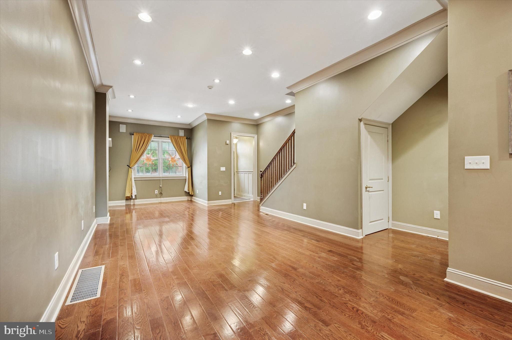 2351 East York Street Philadelphia, PA 19125 - Photo 8 of 44 a view of empty room with wooden floor and fan