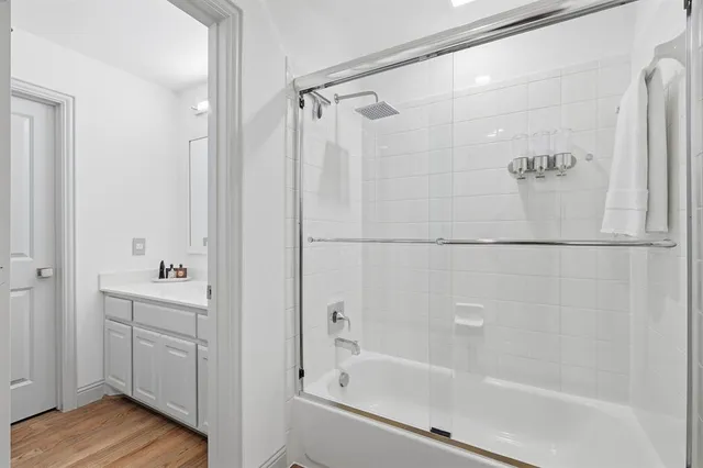 a bathroom with a bathtub and a shower